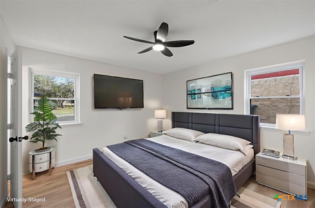 914 Edwards Street Copperas Cove, TX 76522 - Photo 9 of 13 a bedroom with a large bed and a flat screen tv