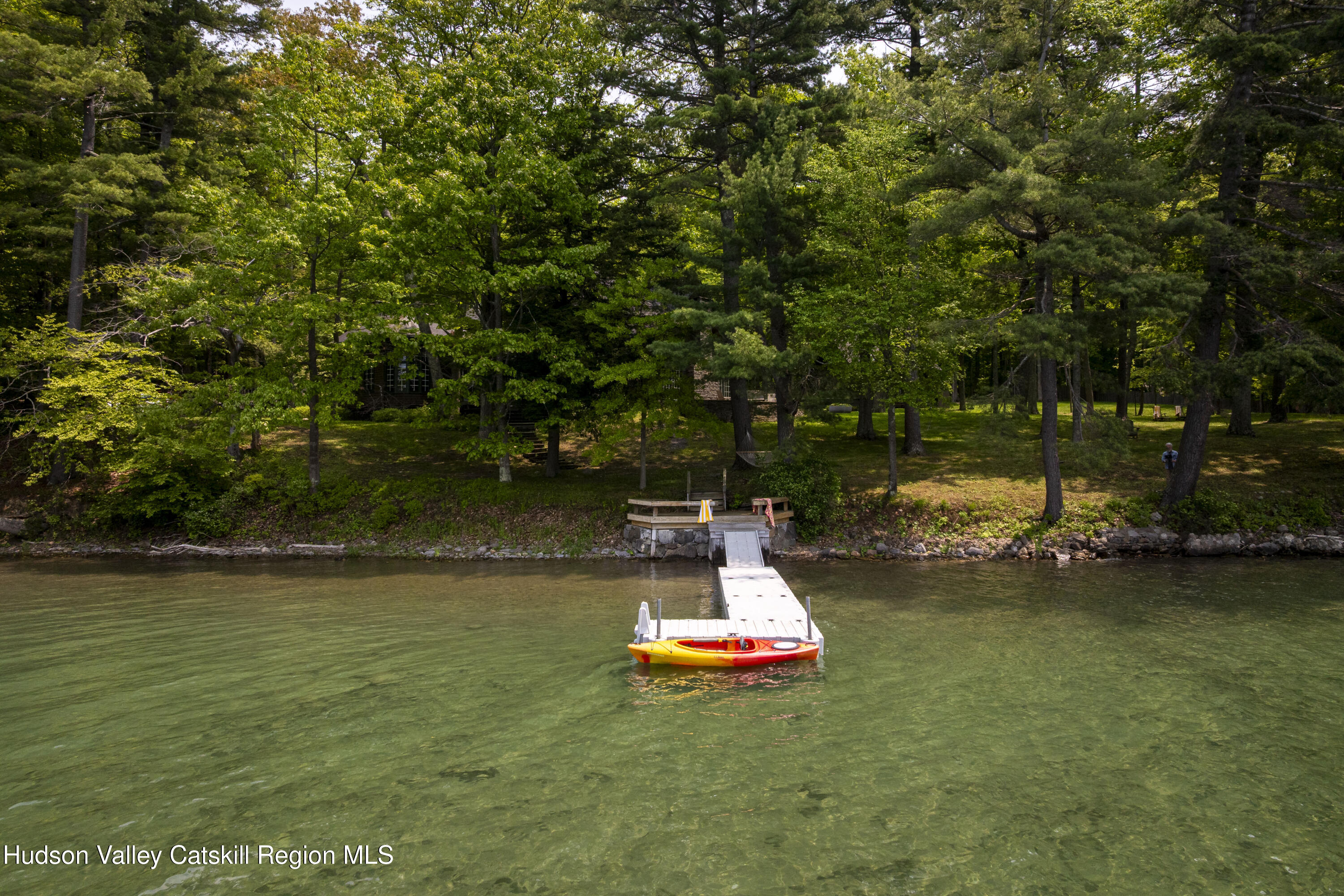 196 Wellington Lane Cooperstown, NY 13326 - Photo 53 of 57 a view of a lake with a park