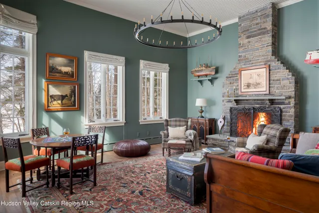 a view of a house with backyard sitting area and garden