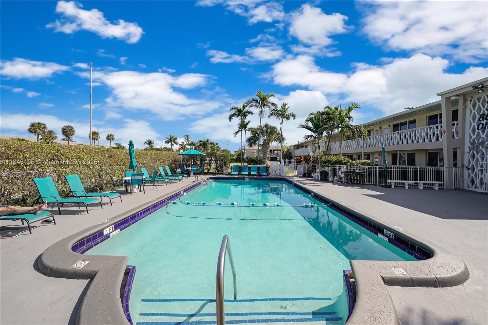 900 Atlantic Shores Boulevard, Unit 215 Hallandale Beach, FL 33009 - Photo 1 of 58 a view of a swimming pool with outdoor seating