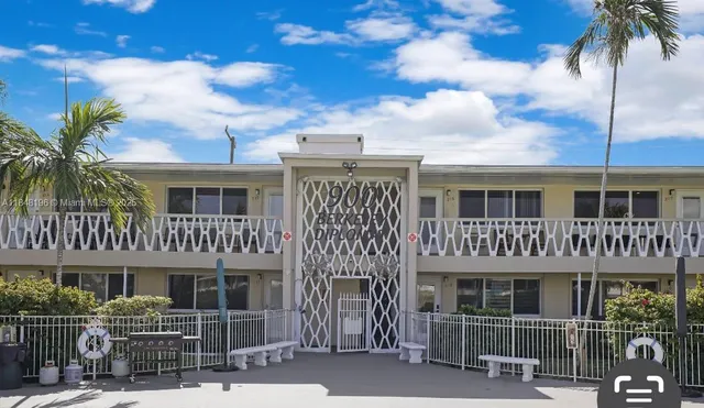 a view of a deck with a table and chair