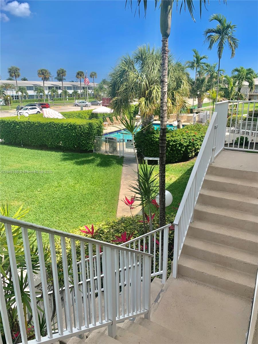 900 Atlantic Shores Boulevard, Unit 215 Hallandale Beach, FL 33009 - Photo 22 of 58 a view of a balcony with yard