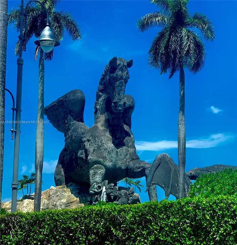 a view of a palm trees front of house