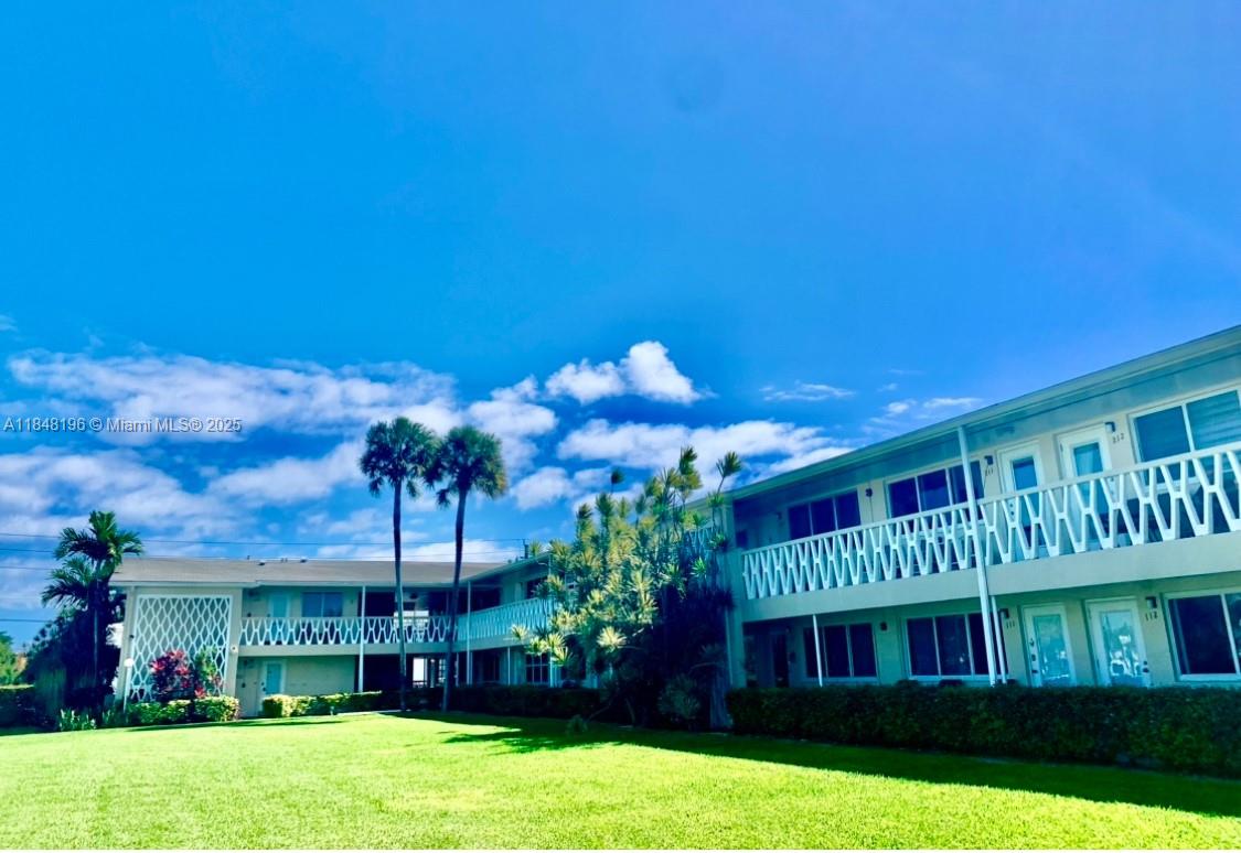 900 Atlantic Shores Boulevard, Unit 215 Hallandale Beach, FL 33009 - Photo 41 of 58 a view of front of house with yard