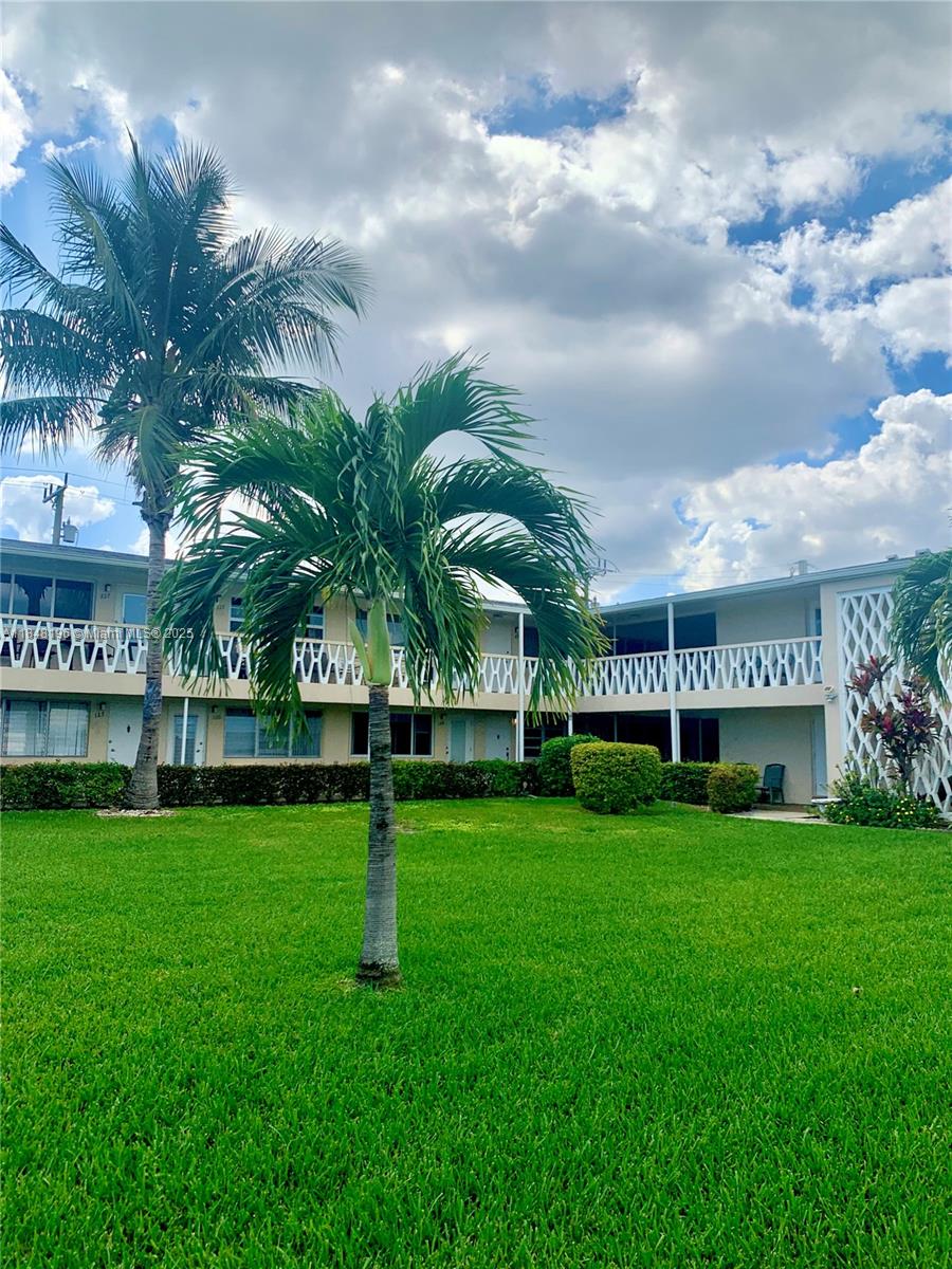 900 Atlantic Shores Boulevard, Unit 215 Hallandale Beach, FL 33009 - Photo 42 of 58 a view of a park with palm trees