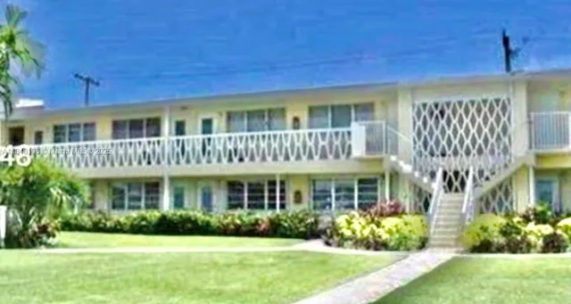 a view of a park with palm trees