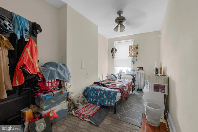 a bedroom with furniture and a closet