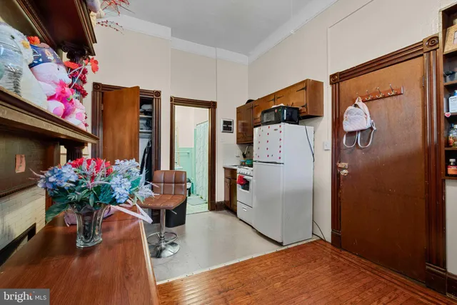 a dining room with furniture and flowers