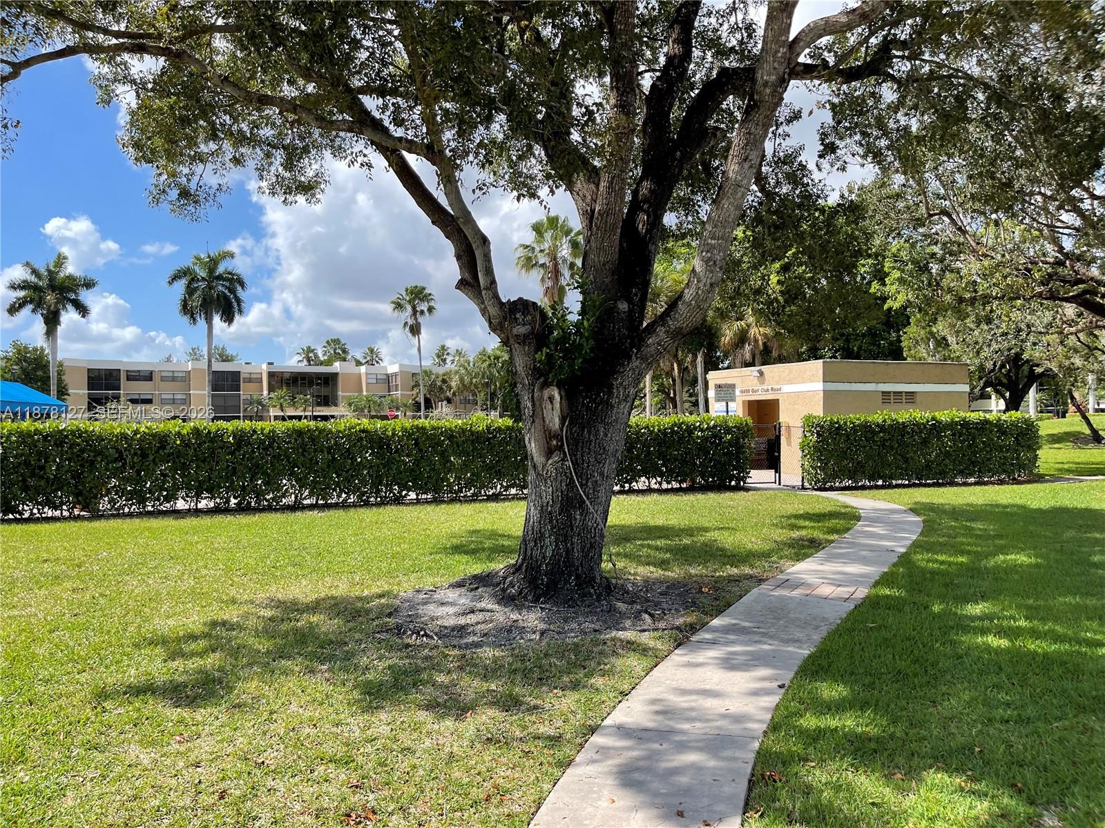 16500 Golf Club Road, Unit 101 Weston, FL 33326 - Photo 27 of 44 a view of a garden with a tree