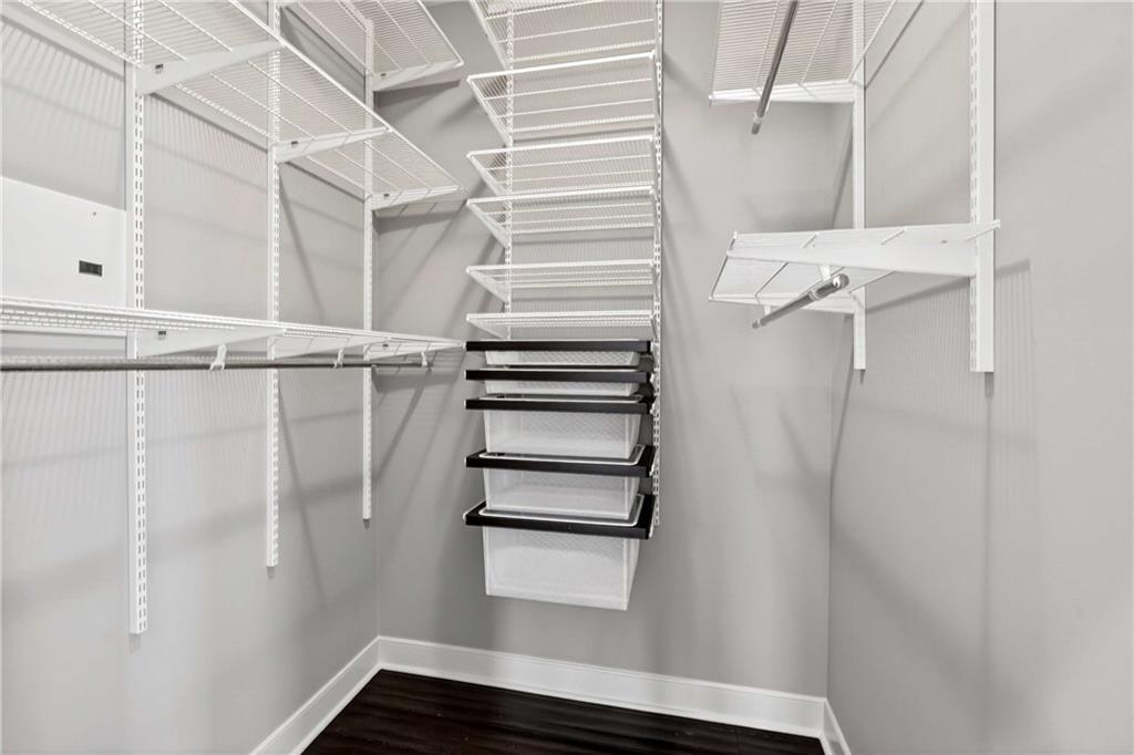 201 West Ponce De Leon Avenue, Unit 702 Decatur, GA 30030 - Photo 18 of 41 a view of walk in closet with empty racks