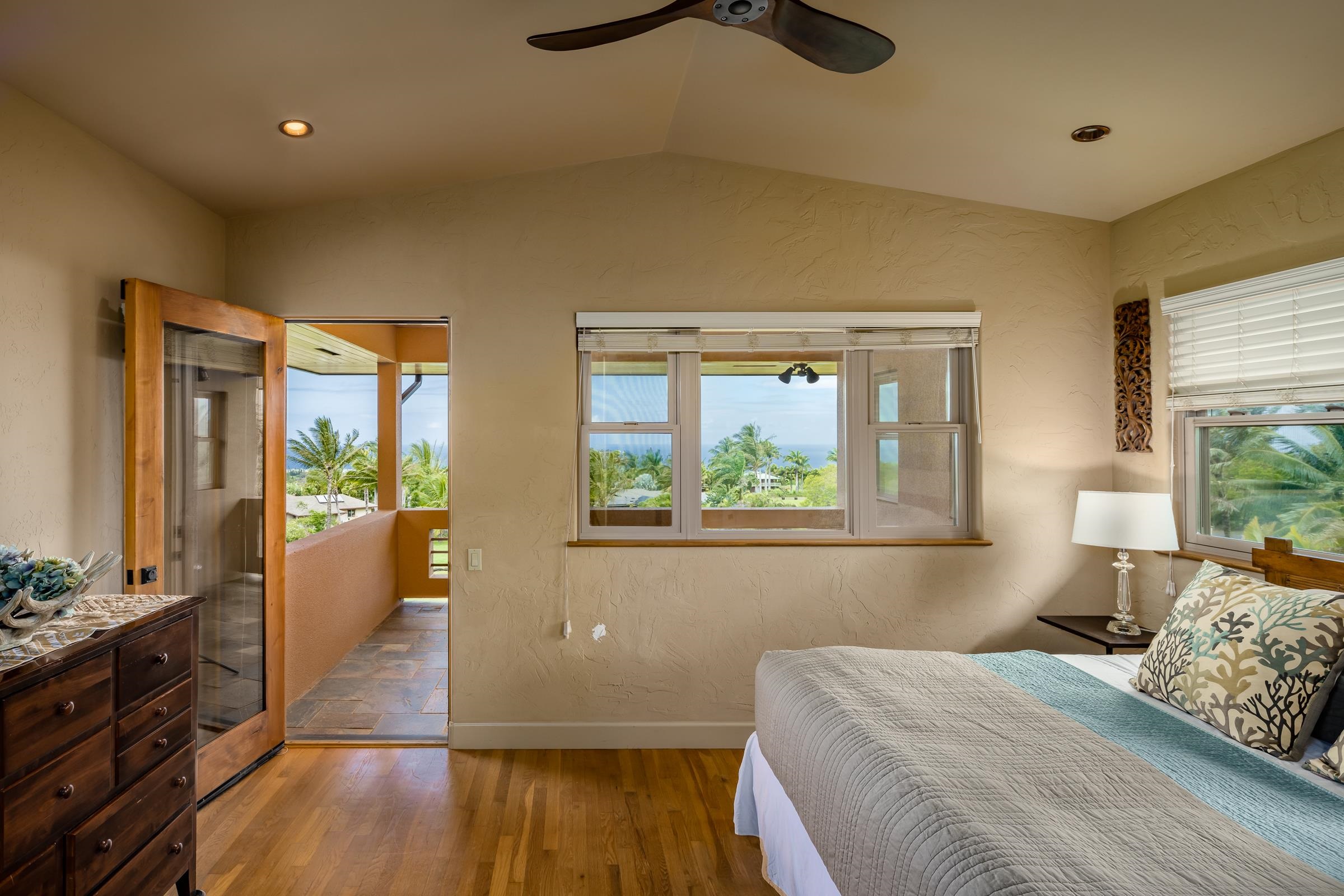 785 West Kuiaha Road Haiku, HI 96708 - Photo 26 of 49 a bedroom with a bed and wooden floor