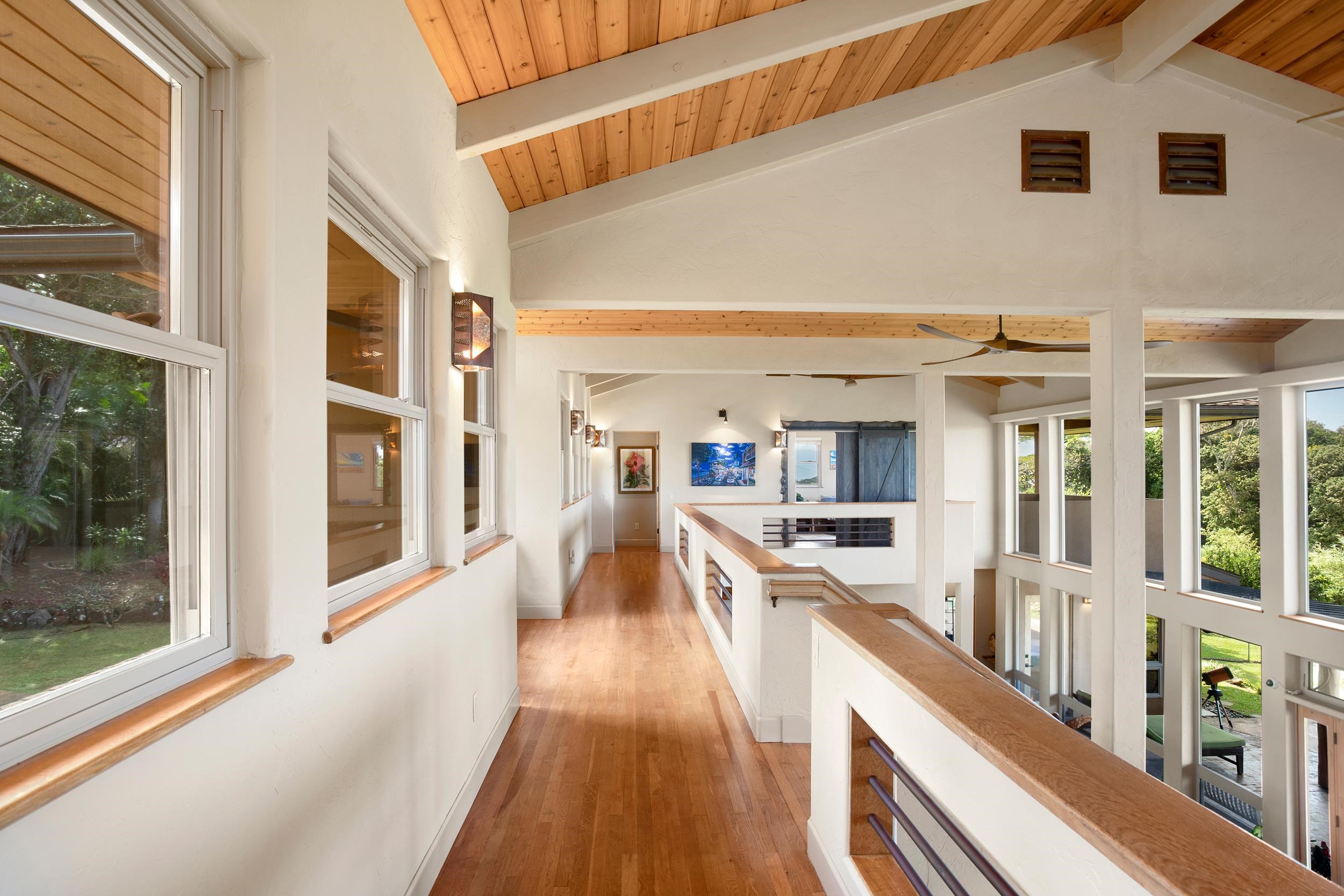 785 West Kuiaha Road Haiku, HI 96708 - Photo 30 of 49 a view of a kitchen with kitchen island wooden floor and stainless steel appliances