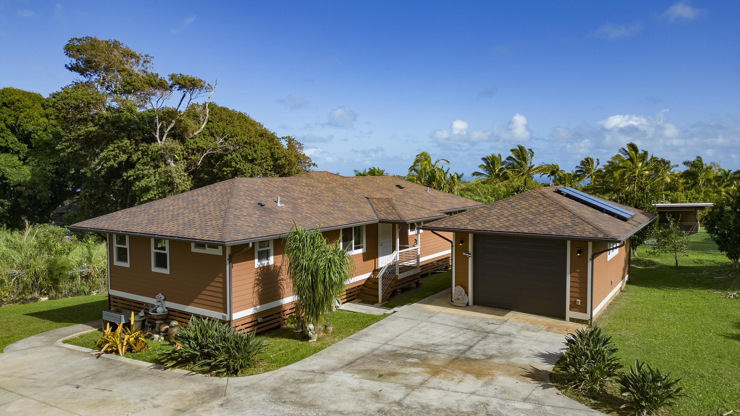 785 West Kuiaha Road Haiku, HI 96708 - Photo 39 of 49 a front view of a house with a yard plants and outdoor seating