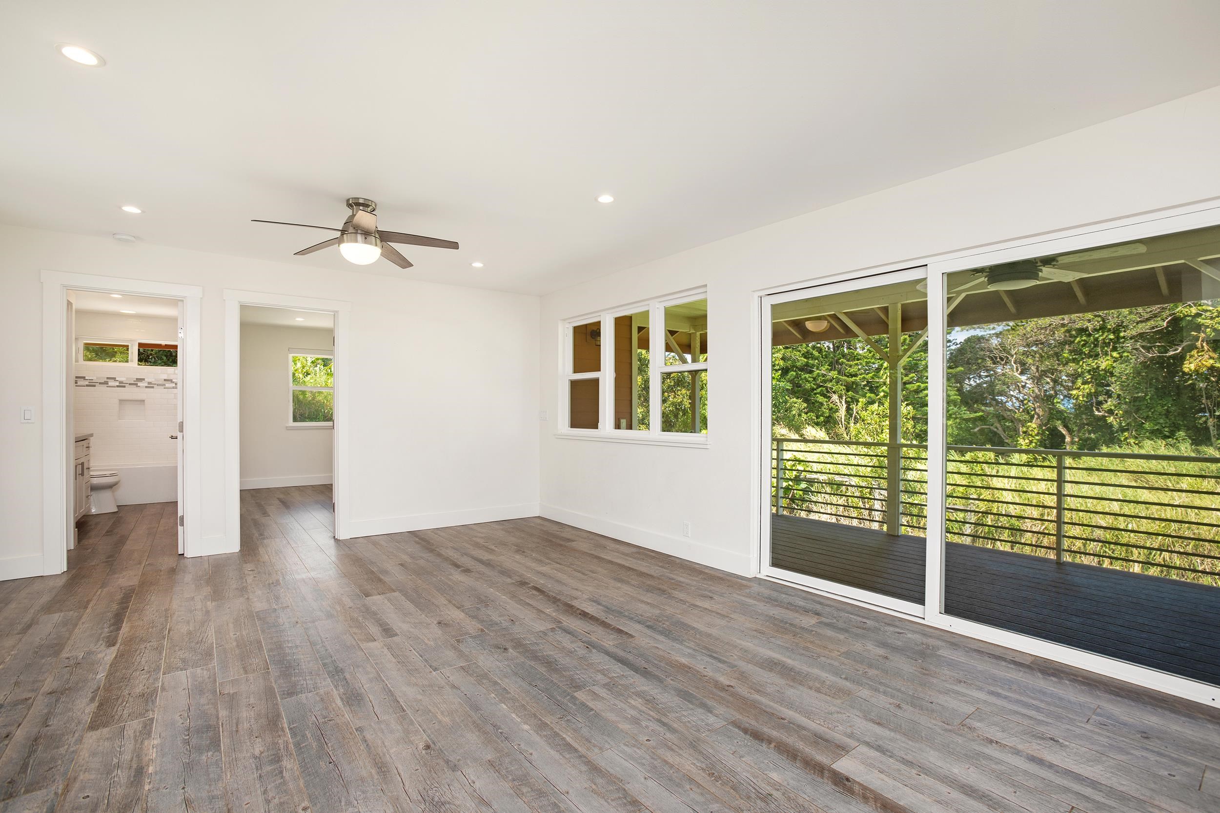 785 West Kuiaha Road Haiku, HI 96708 - Photo 41 of 49 wooden floor in an empty room with a window