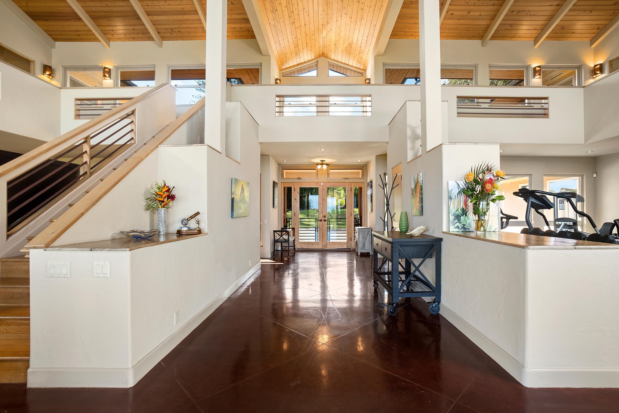 785 West Kuiaha Road Haiku, HI 96708 - Photo 7 of 49 a view of a hallway with dining room and wooden floor