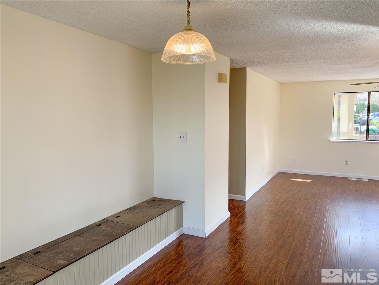 6809 Flower Street Reno, NV 89506 - Photo 7 of 15 wooden floor in an empty room with a window