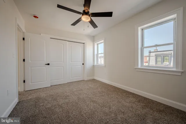 a view of a backyard with sitting area