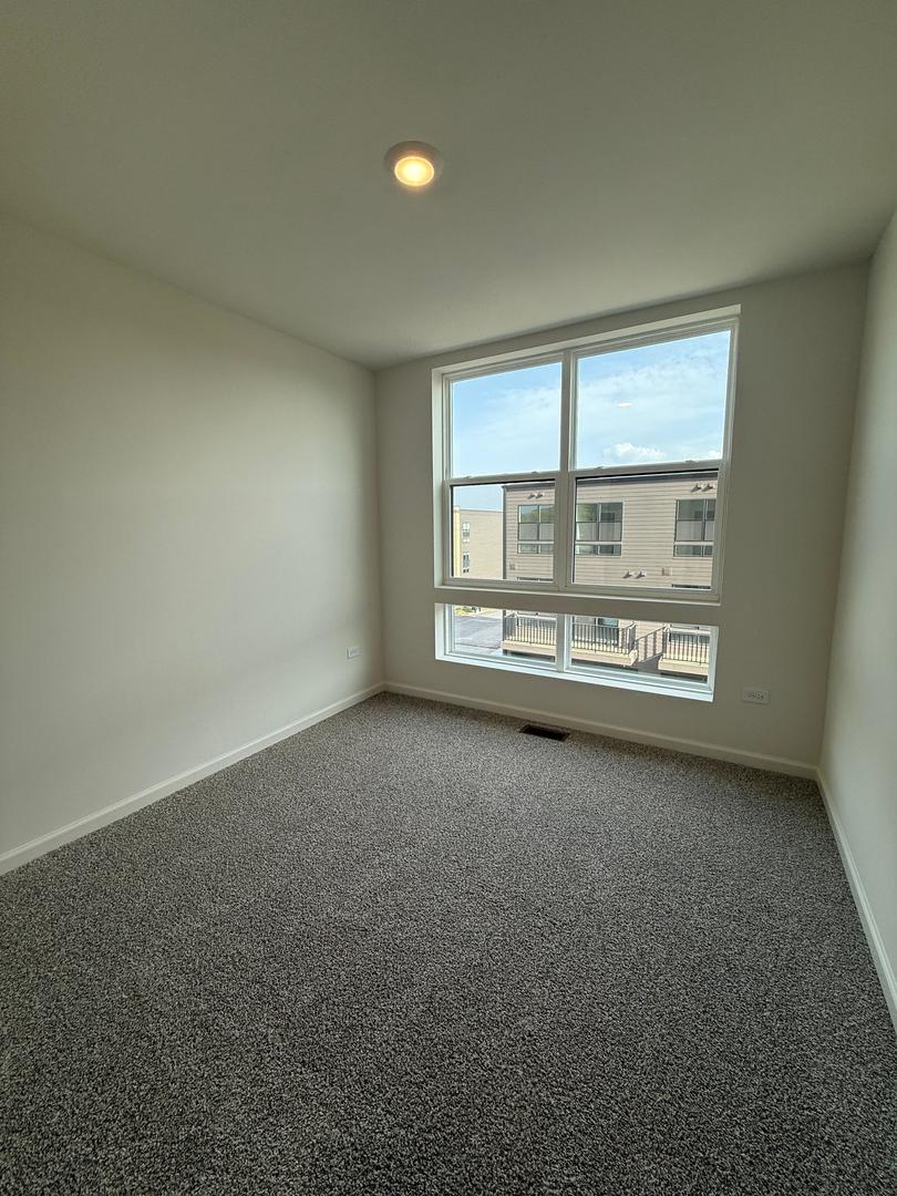 347 Summit Circle Lombard, IL 60148 - Photo 12 of 18 an empty room with a empty space and windows