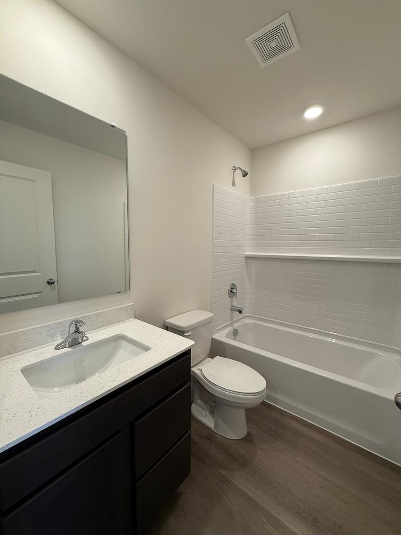 347 Summit Circle Lombard, IL 60148 - Photo 16 of 18 a bathroom with a sink toilet a mirror and shower