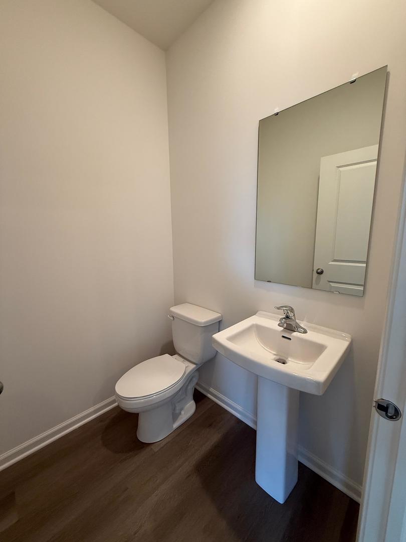 347 Summit Circle Lombard, IL 60148 - Photo 17 of 18 a bathroom with a sink toilet and mirror