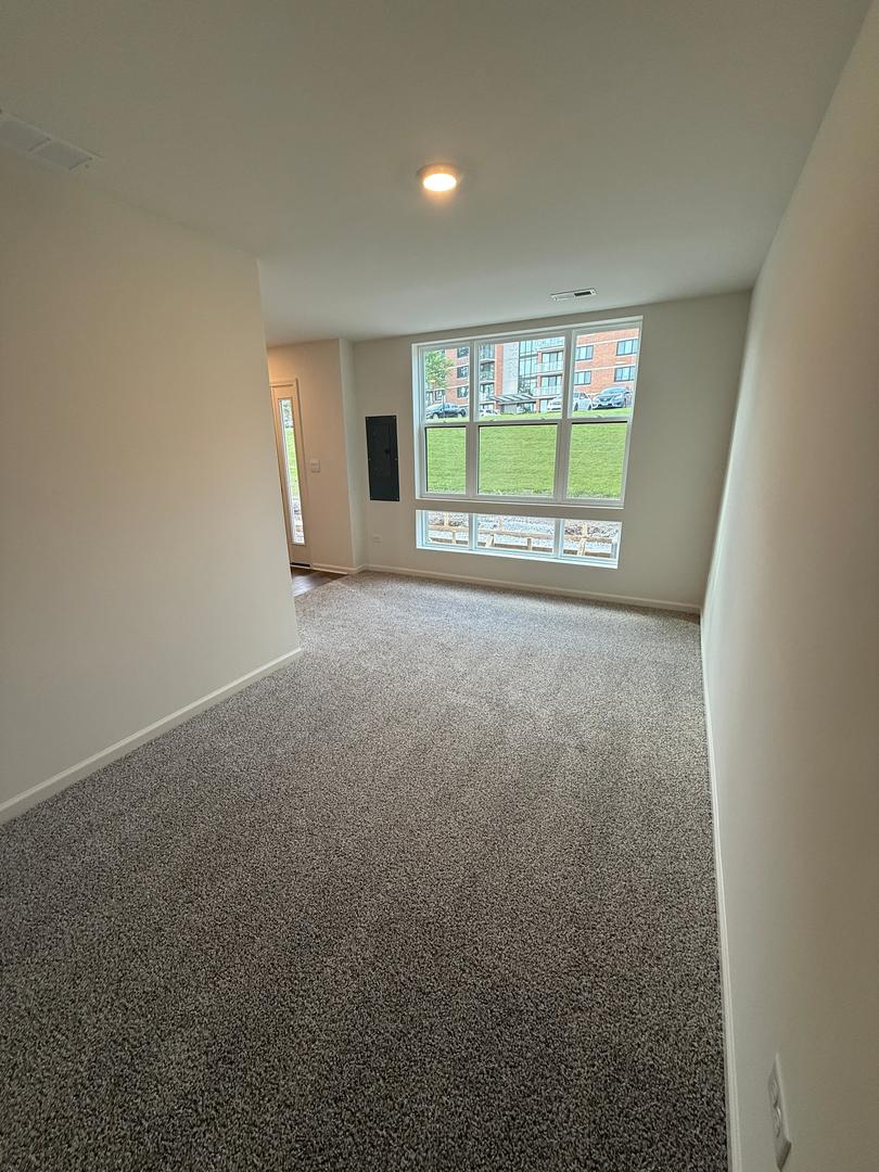 347 Summit Circle Lombard, IL 60148 - Photo 9 of 18 a view of an empty room with a window