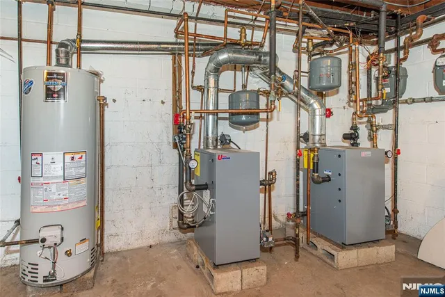 a utility room with multiple dryer and washer