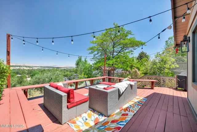 a outdoor living room with furniture and garden