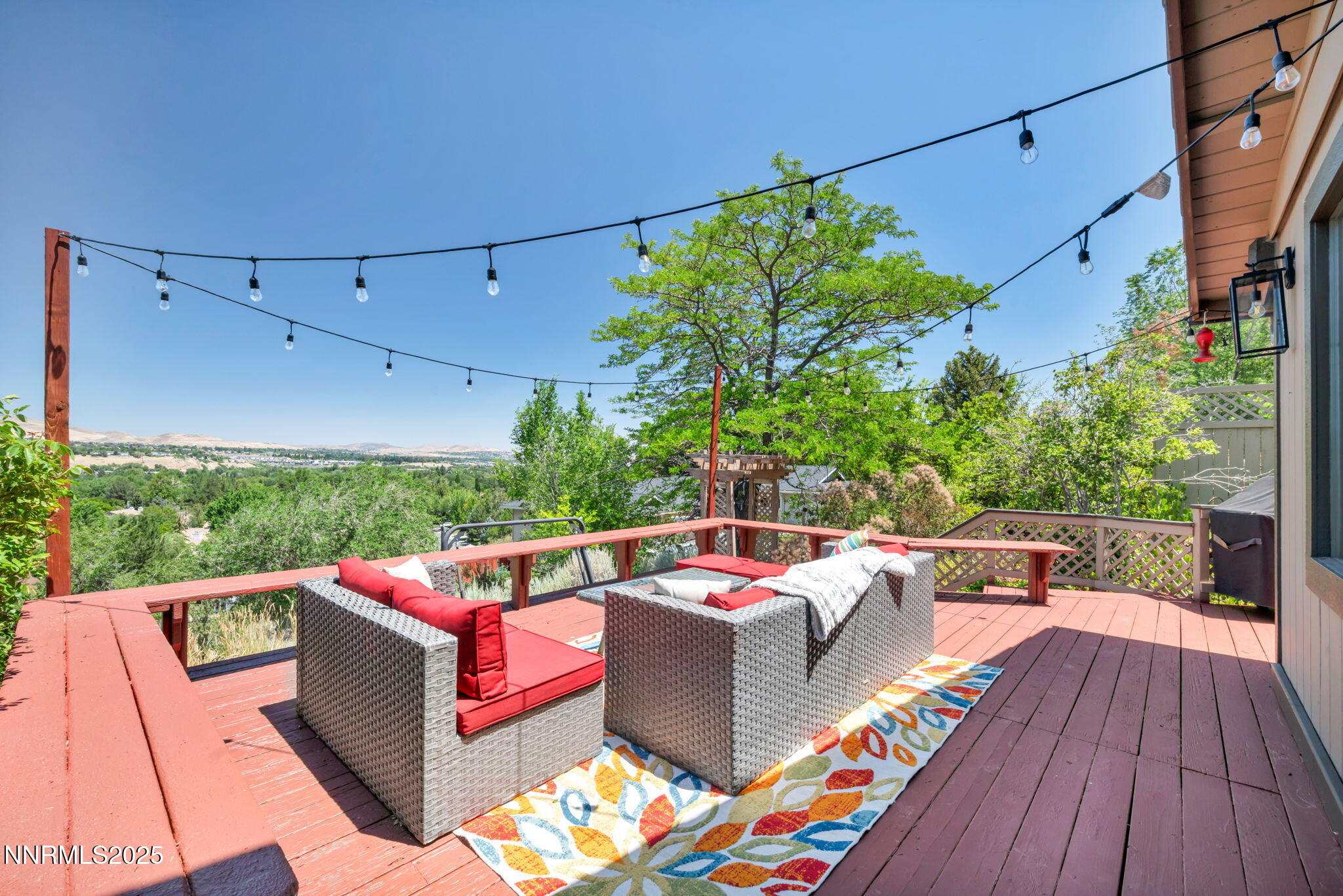 a outdoor living room with furniture and garden
