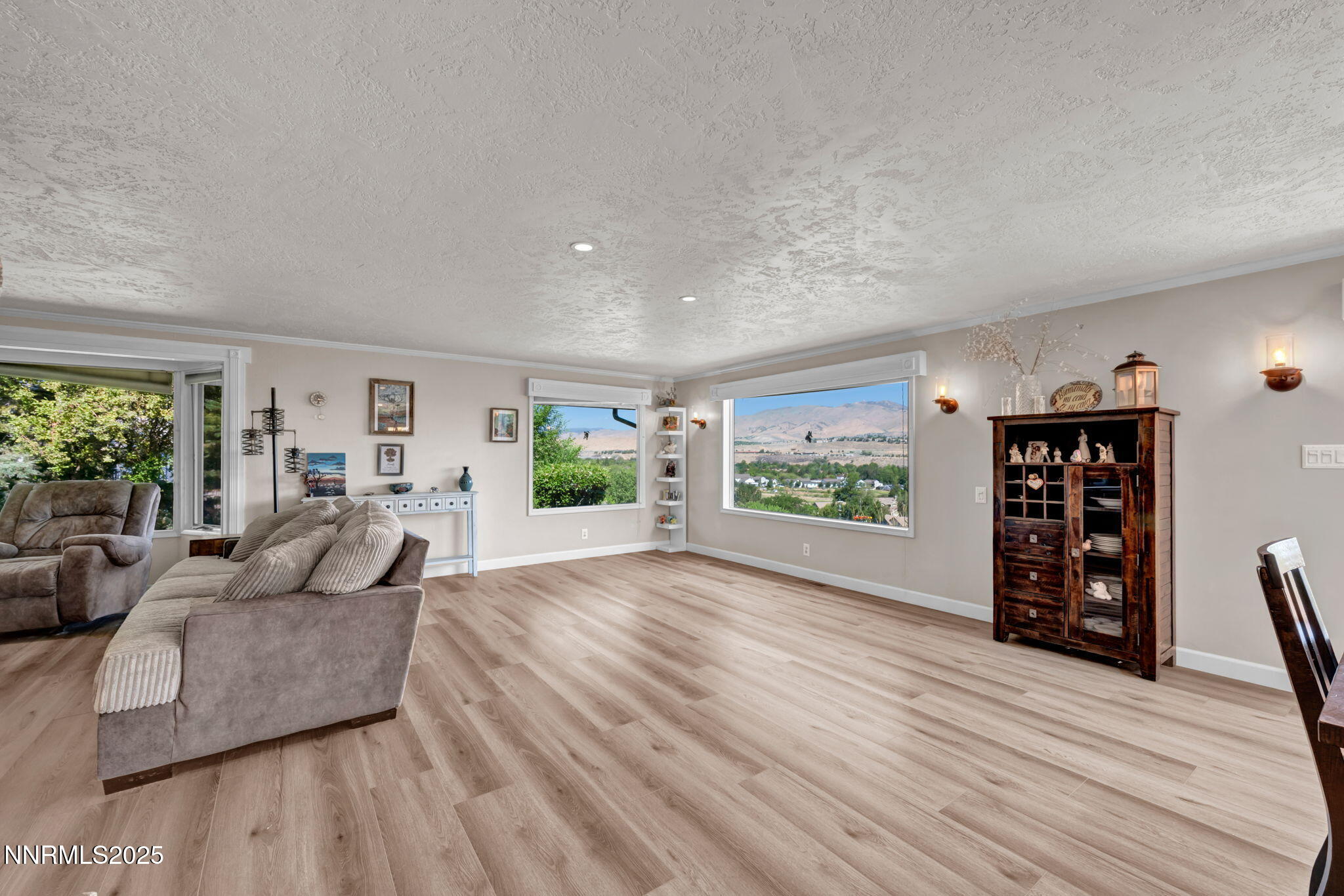 3495 West Plumb Lane Reno, NV 89509 - Photo 11 of 38 a living room with furniture and a wooden floor