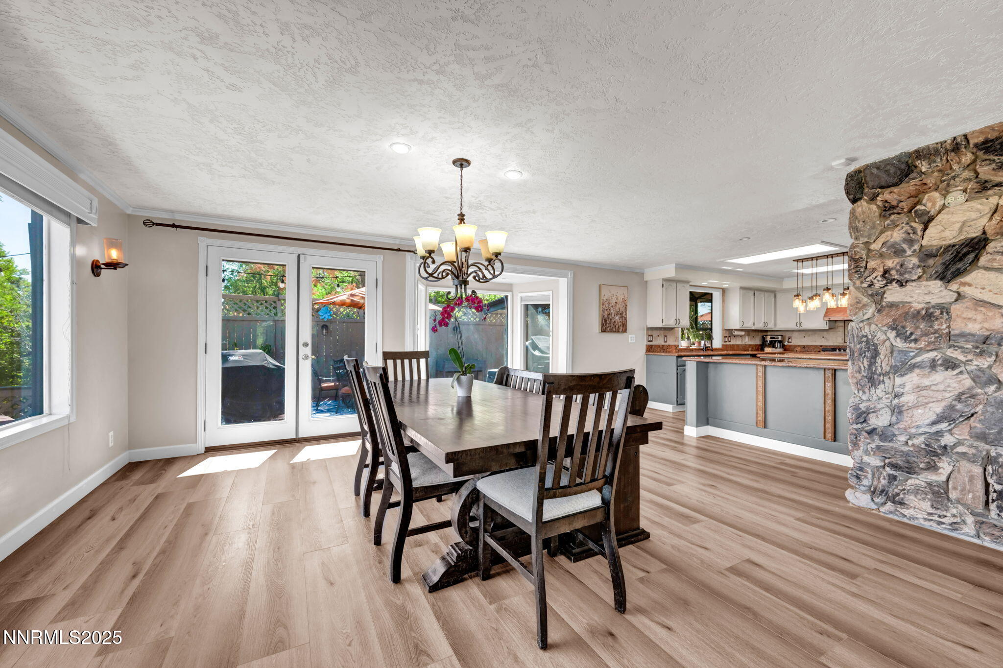 3495 West Plumb Lane Reno, NV 89509 - Photo 13 of 38 a view of a dining room with furniture window and wooden floor