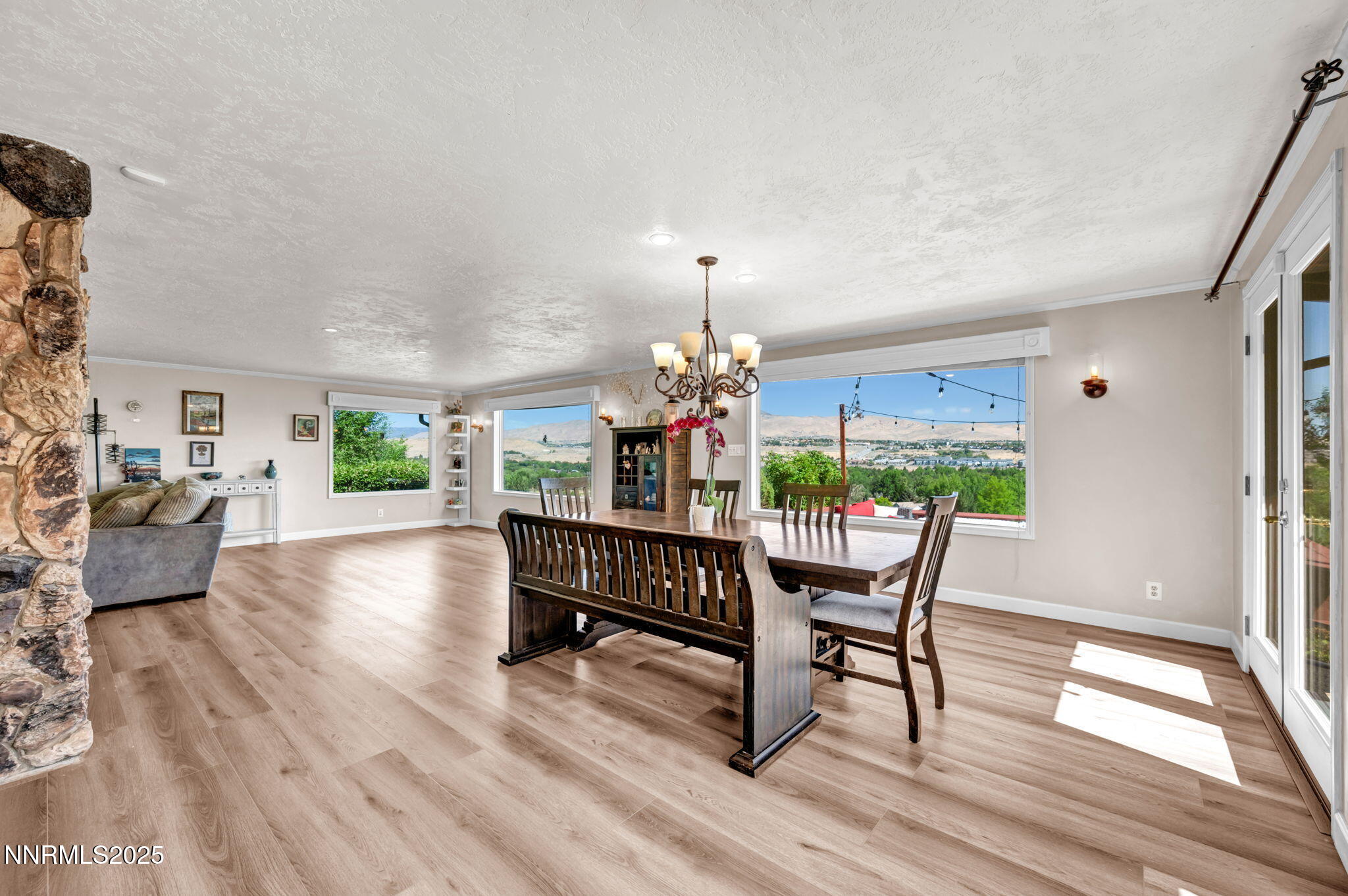 3495 West Plumb Lane Reno, NV 89509 - Photo 15 of 38 a dining room with furniture window and wooden floor