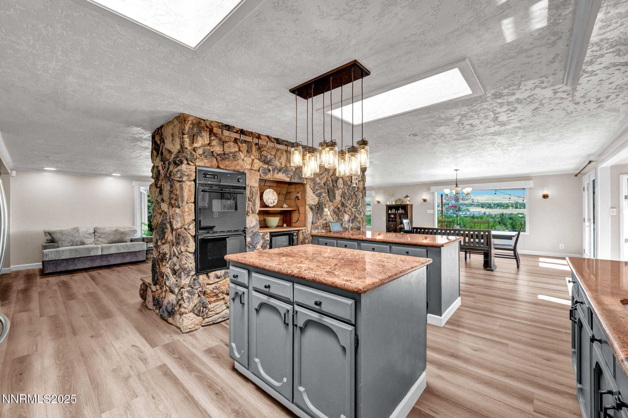 3495 West Plumb Lane Reno, NV 89509 - Photo 17 of 38 a dining hall with stainless steel appliances granite countertop a stove and chairs