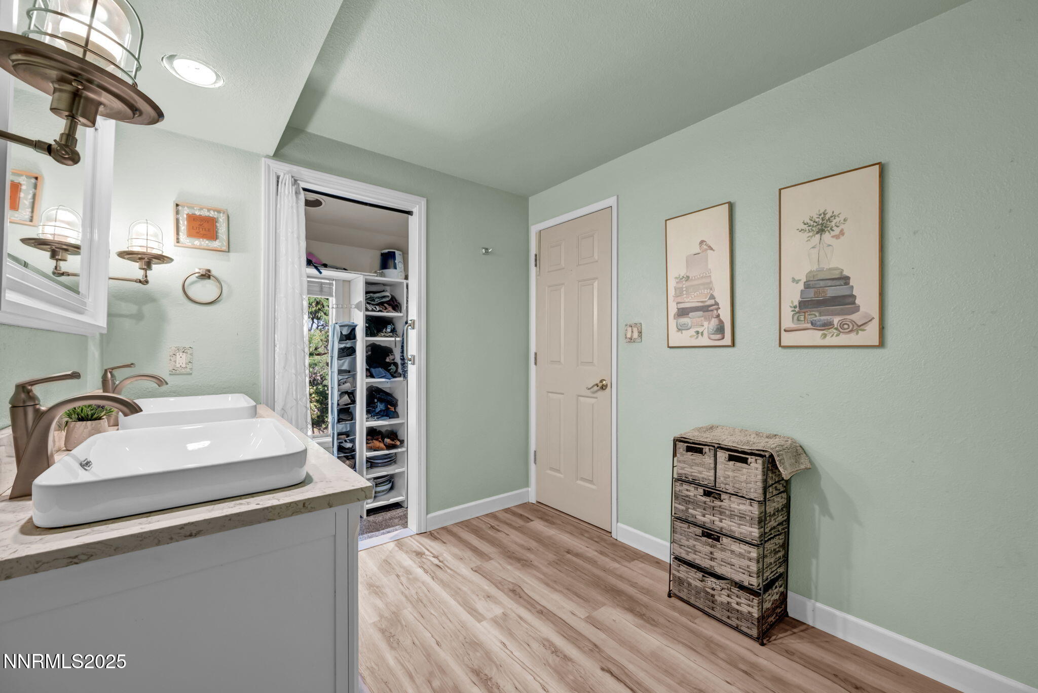 3495 West Plumb Lane Reno, NV 89509 - Photo 22 of 38 a room with a bed and a dresser