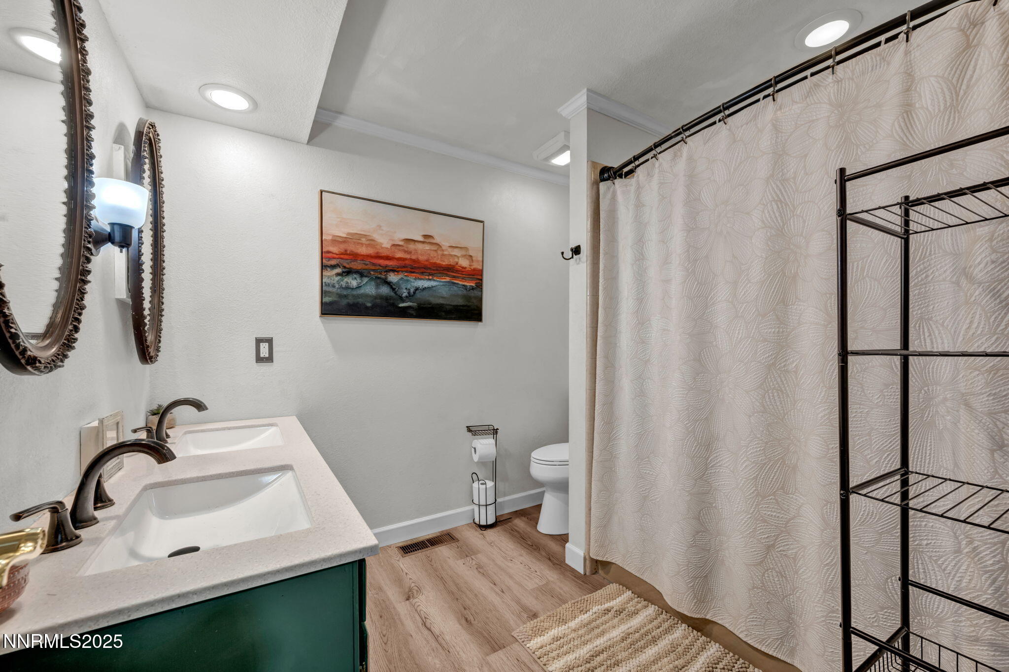 3495 West Plumb Lane Reno, NV 89509 - Photo 27 of 38 a bathroom with a sink toilet and shower