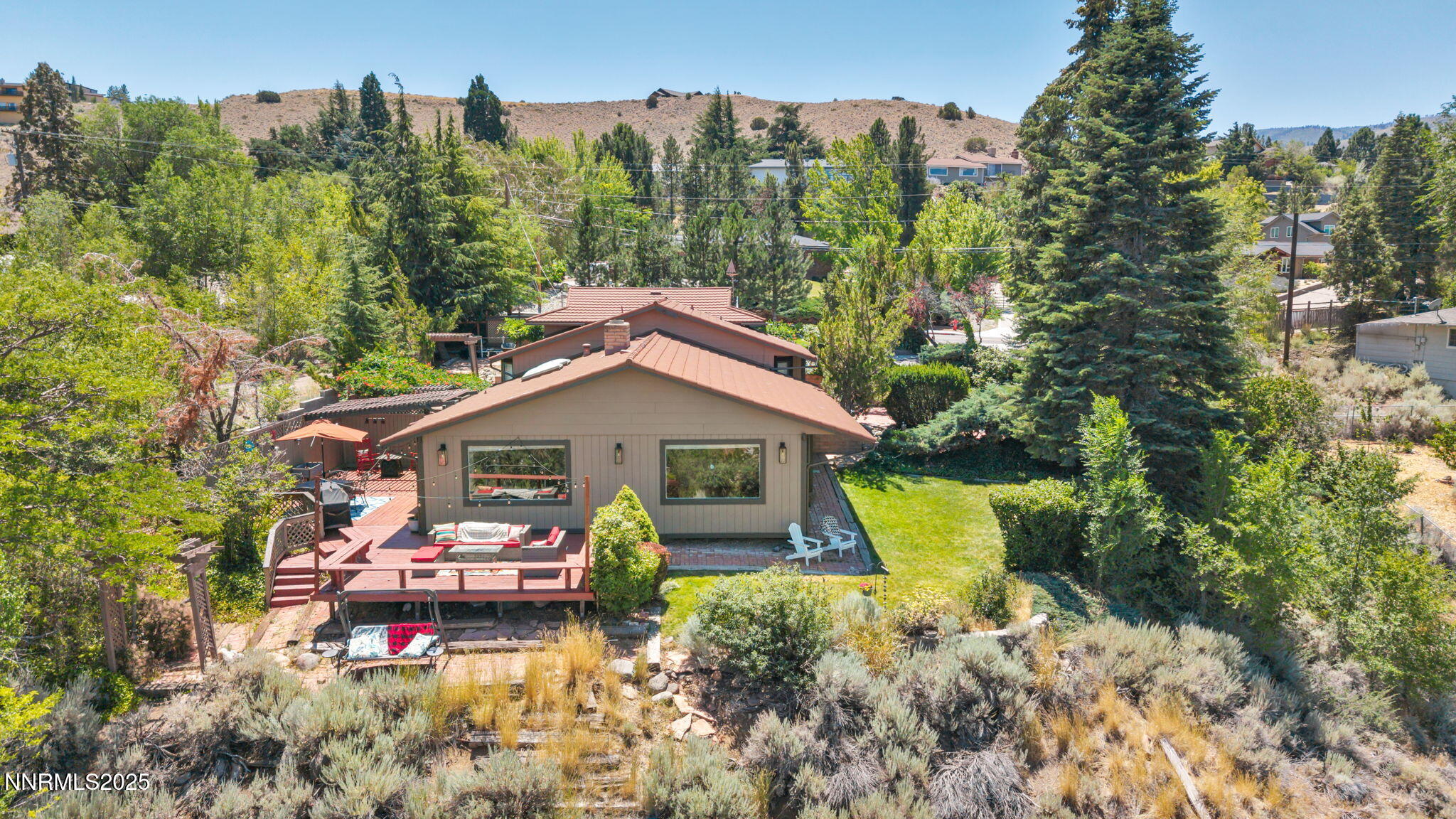 3495 West Plumb Lane Reno, NV 89509 - Photo 28 of 38 a view of a house with pool and chairs