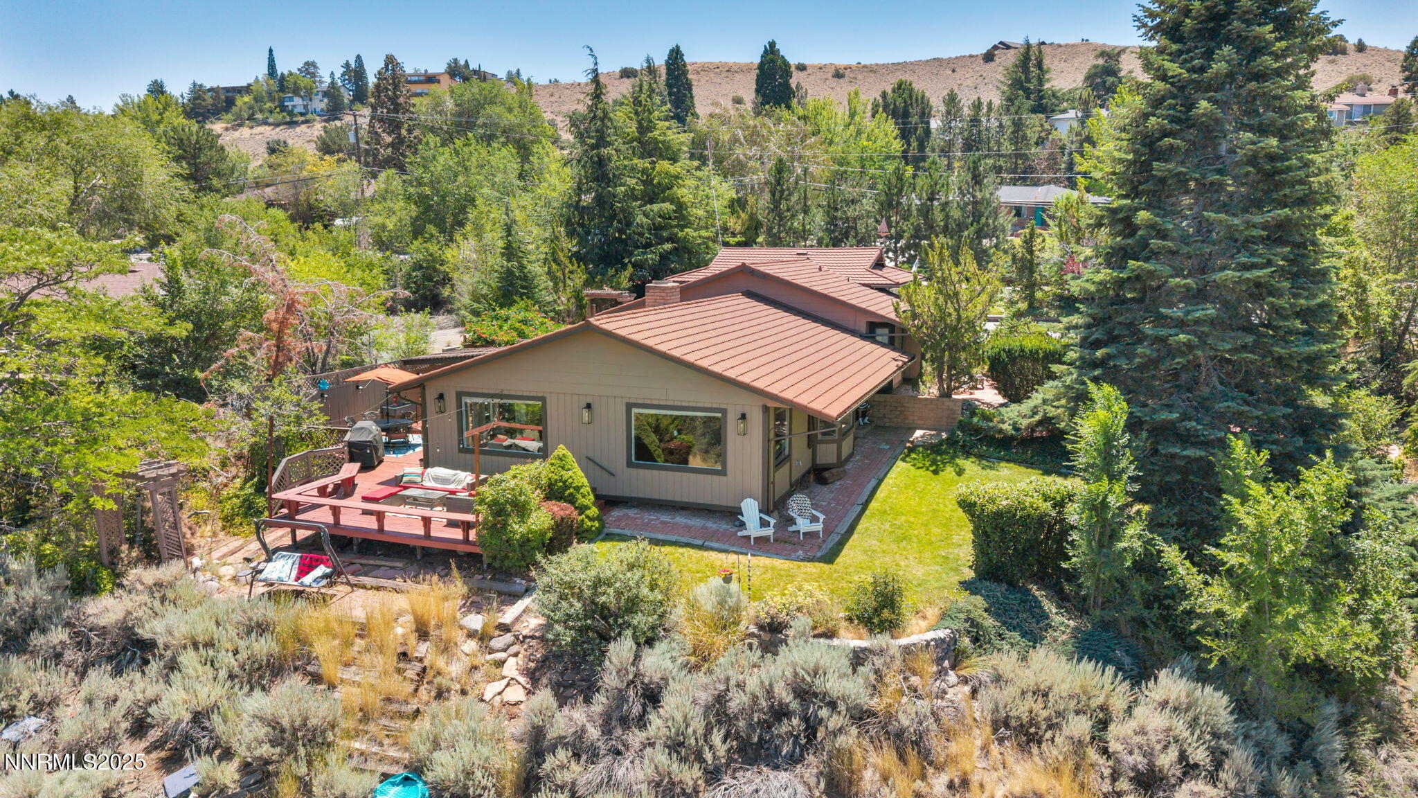 3495 West Plumb Lane Reno, NV 89509 - Photo 29 of 38 an aerial view of a house with swimming pool and trees