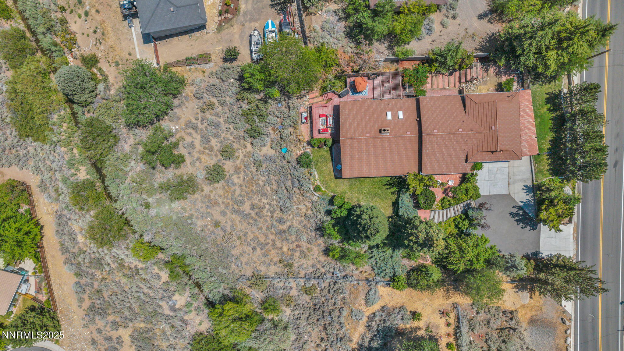 3495 West Plumb Lane Reno, NV 89509 - Photo 31 of 38 an aerial view of a house with a yard and a large tree