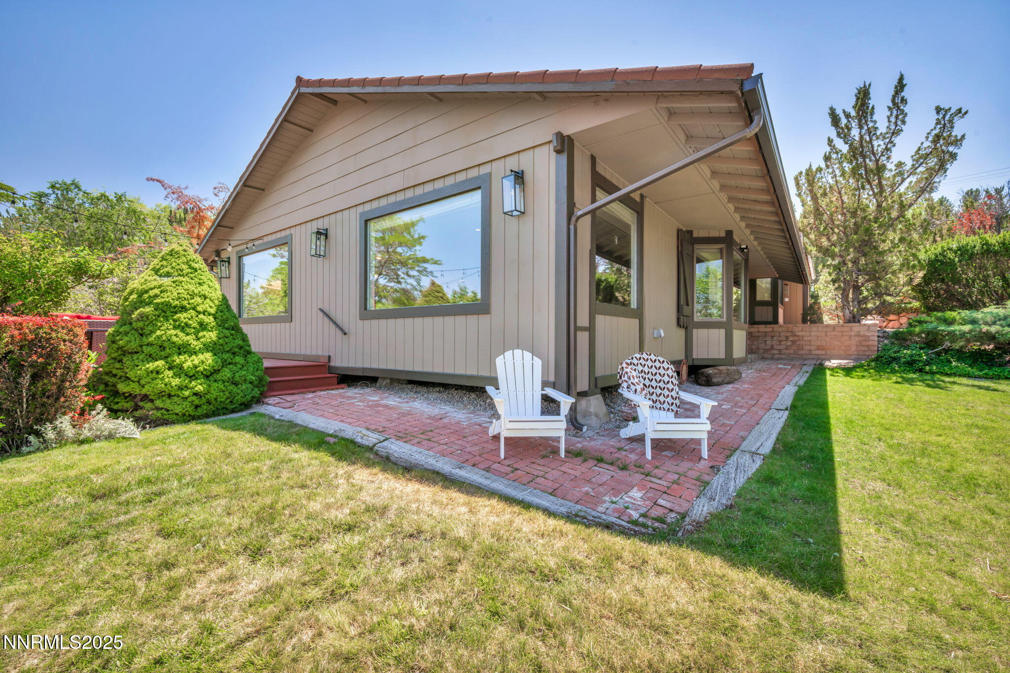 3495 West Plumb Lane Reno, NV 89509 - Photo 6 of 38 a front view of a house with garden