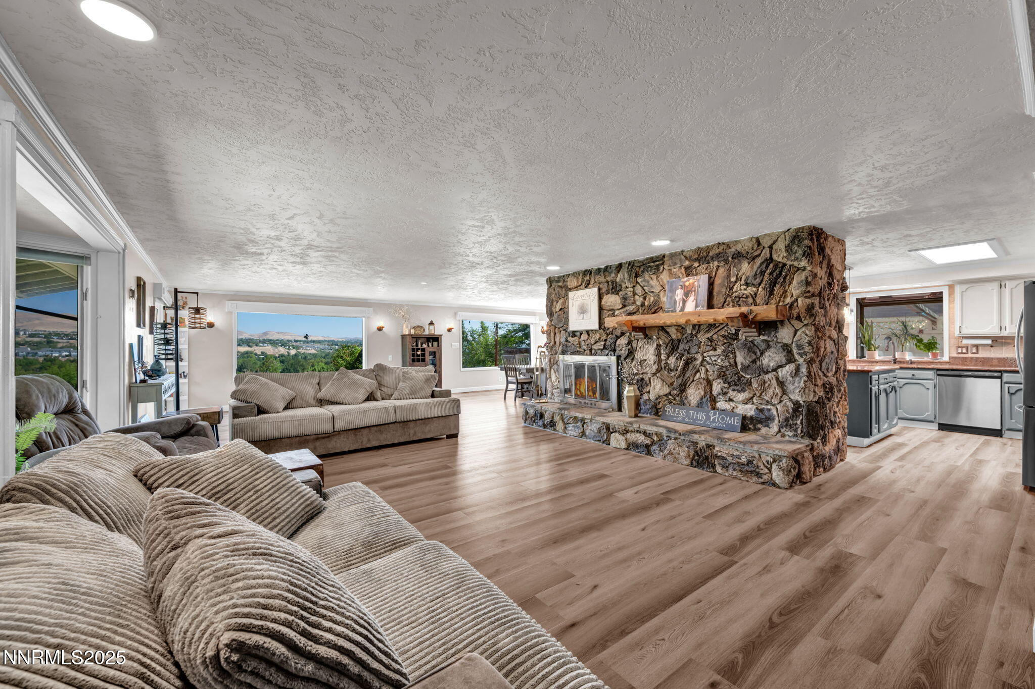 3495 West Plumb Lane Reno, NV 89509 - Photo 7 of 38 a living room with furniture and wooden floor