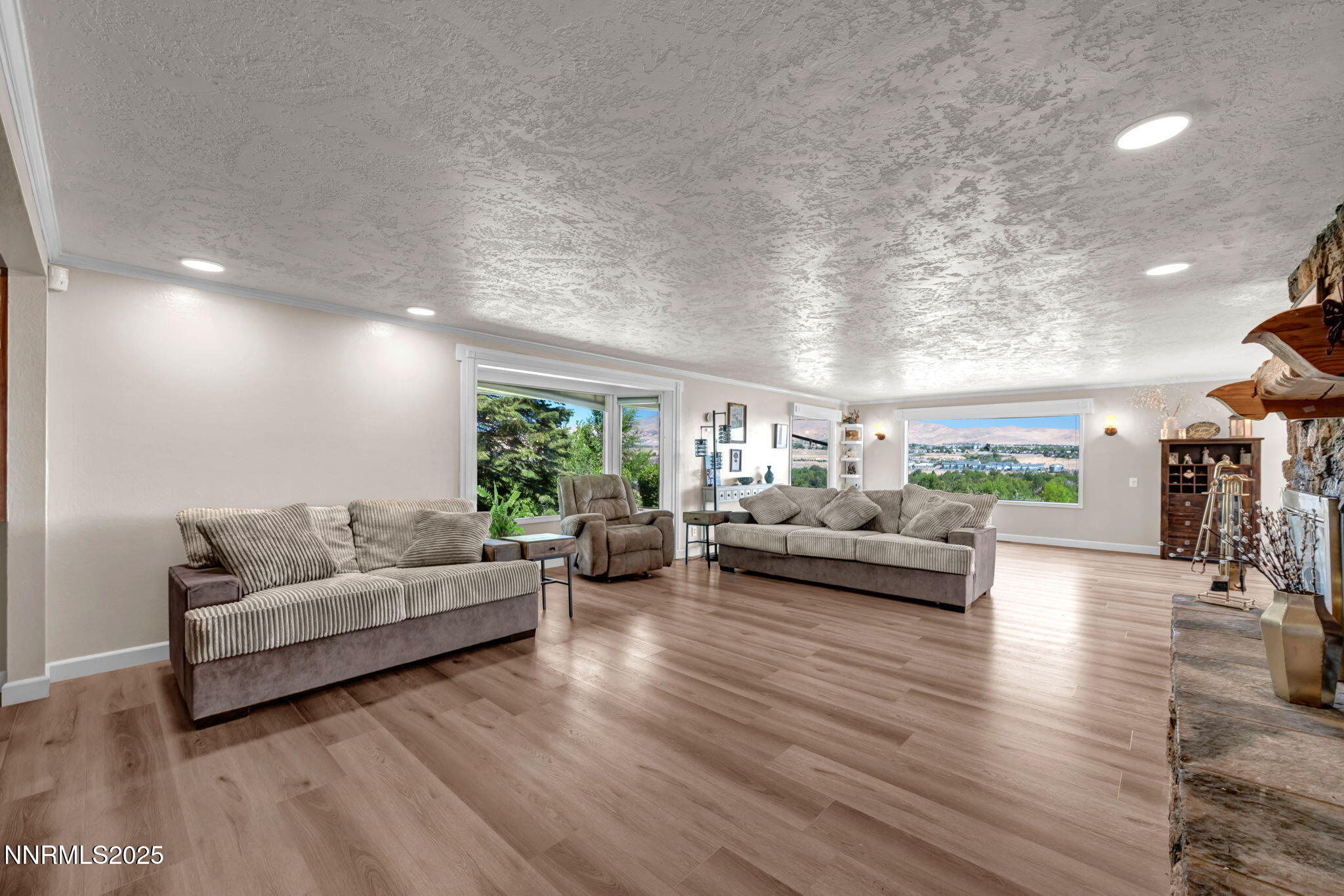 3495 West Plumb Lane Reno, NV 89509 - Photo 8 of 38 a living room with furniture and a wooden floor