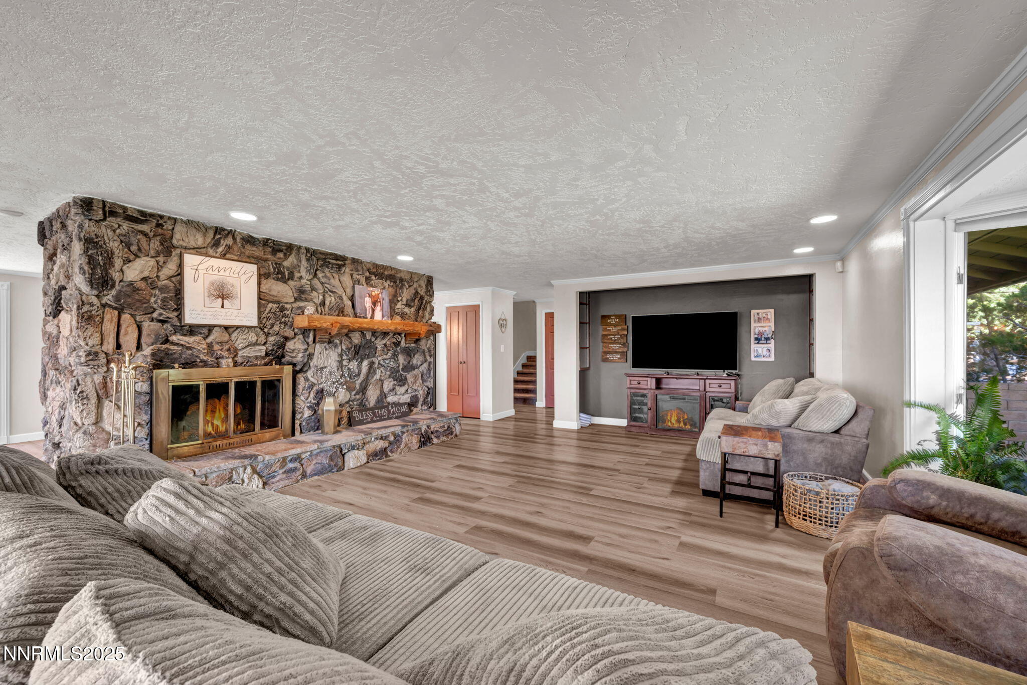 3495 West Plumb Lane Reno, NV 89509 - Photo 9 of 38 a living room with furniture and a flat screen tv