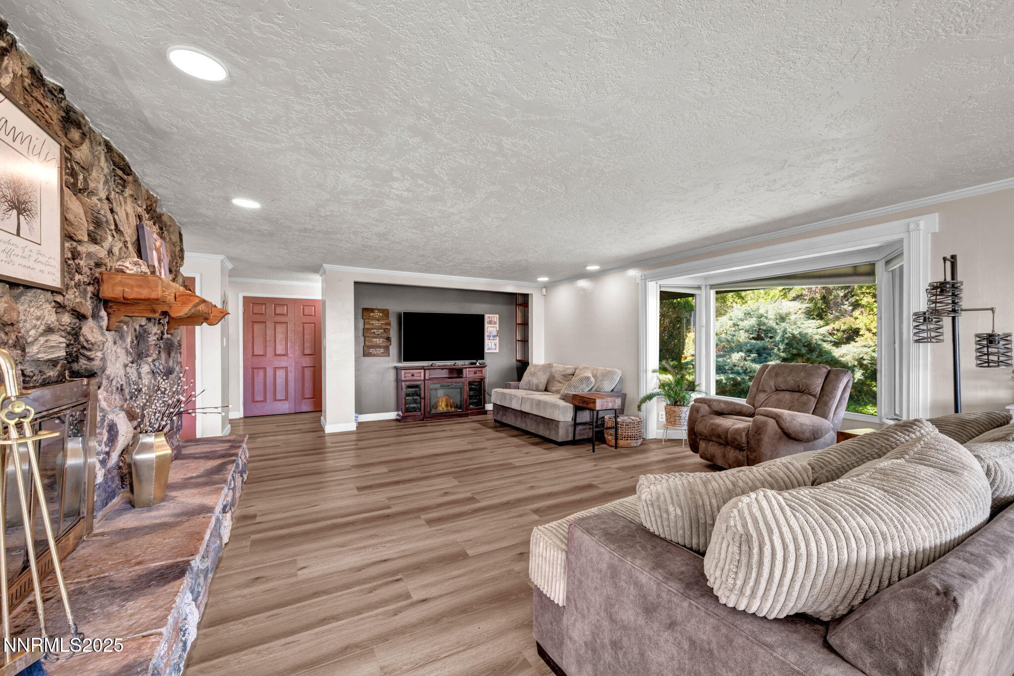 3495 West Plumb Lane Reno, NV 89509 - Photo 10 of 38 a living room with furniture and a flat screen tv