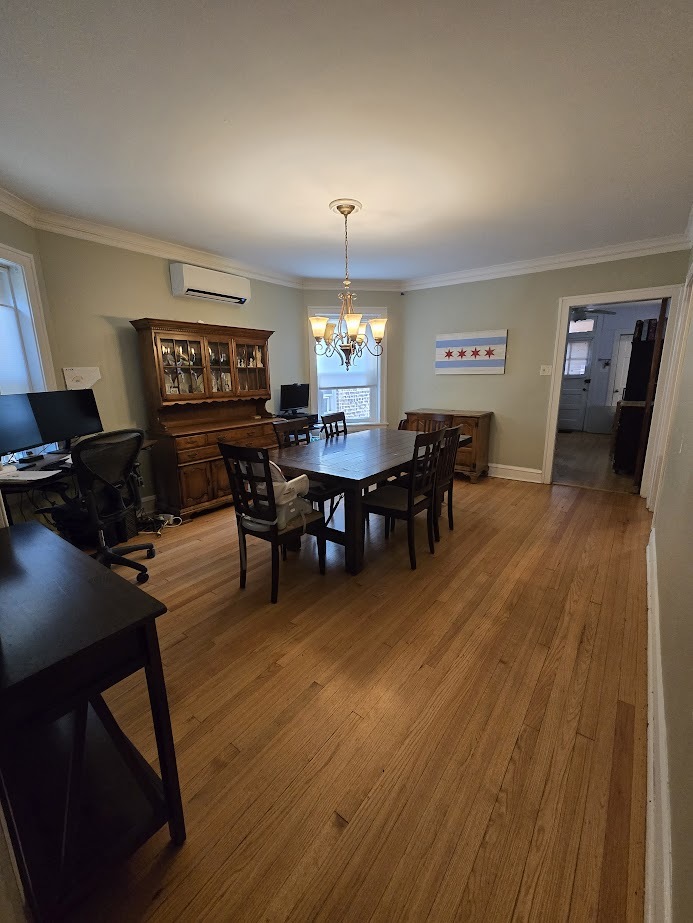 5910 North Campbell Avenue Chicago, IL 60659 - Photo 7 of 14 a view of a dining room with furniture window and wooden floor