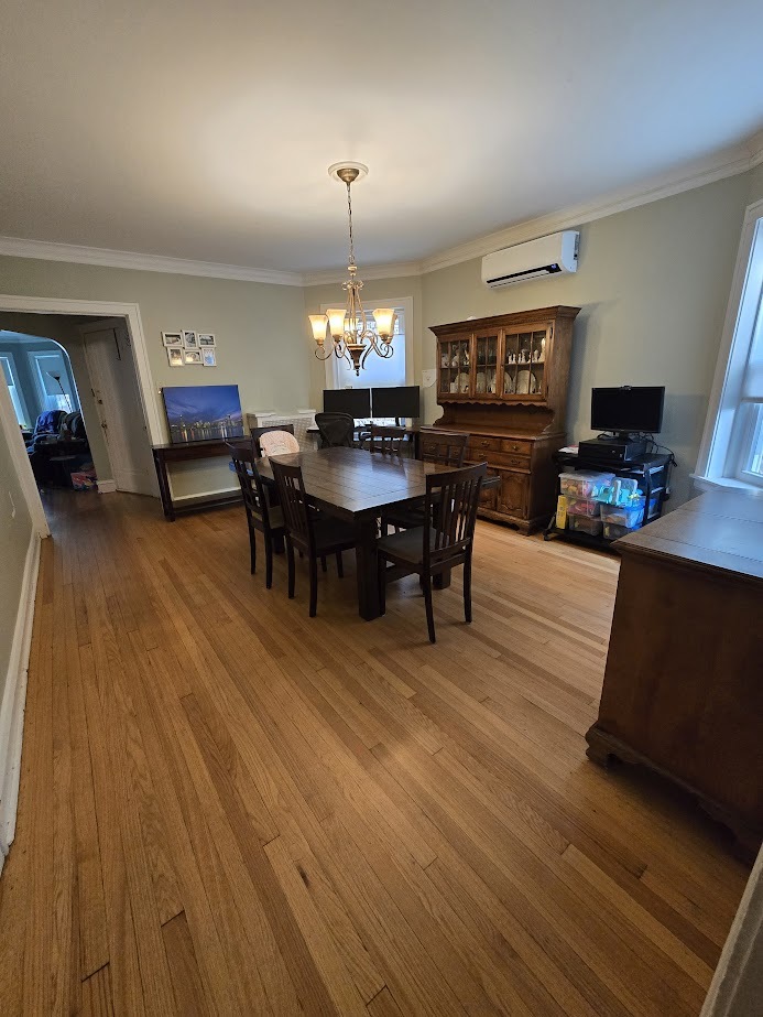 5910 North Campbell Avenue Chicago, IL 60659 - Photo 8 of 14 a living room with furniture and a wooden floor