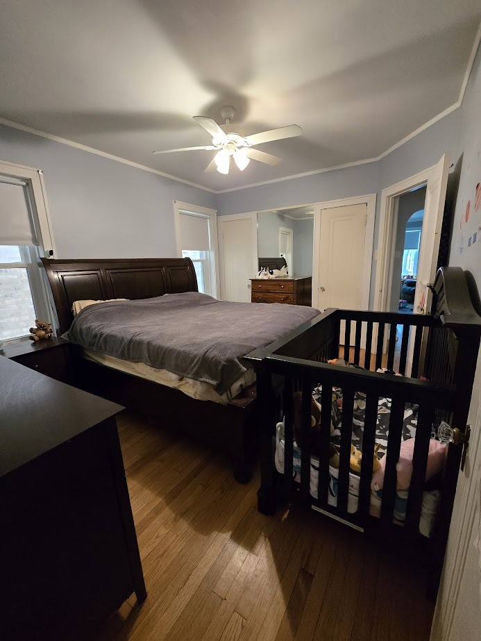 5910 North Campbell Avenue Chicago, IL 60659 - Photo 9 of 14 a bedroom with furniture and a window