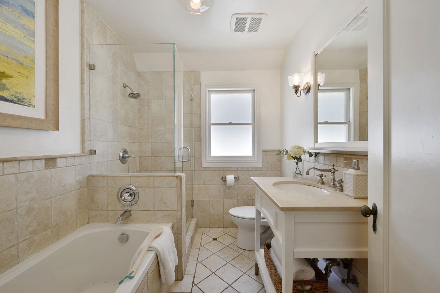 22 Channing Road Burlingame, CA 94010 - Photo 31 of 46 a bathroom with a tub sink and mirror