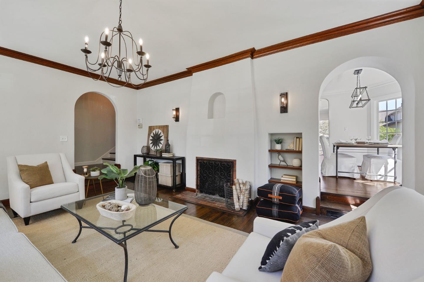 22 Channing Road Burlingame, CA 94010 - Photo 7 of 46 a living room with furniture a chandelier and a fireplace
