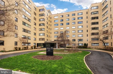 a front view of a building with garden