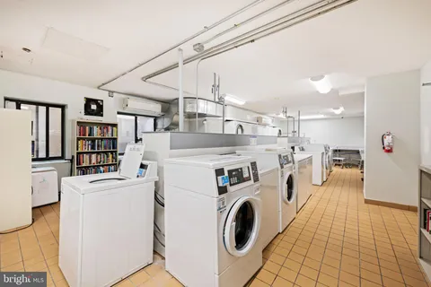 a room with gym equipment and a large window