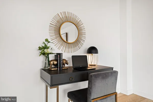 a room with a table and a mirror